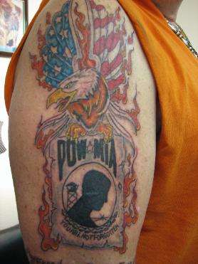 POW flag and eagle tattoo