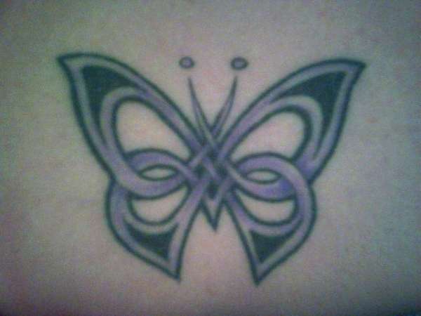 Woven Butterfly(lower back) tattoo