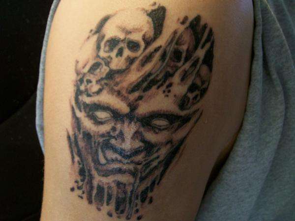 tearing face tattoo