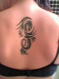 swirly dragon tattoo