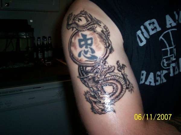 japanese dragon around old kanji..... tattoo