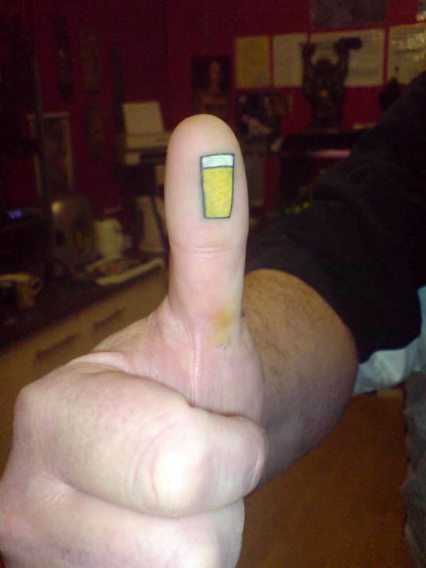 Thumbs up tattoo