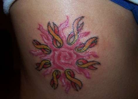 SUN ON MY SIDE (RIBS) tattoo