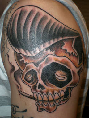 skull with pompadour tattoo