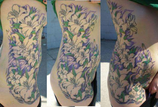 lilies on ribs (third sit 4hrs) tattoo