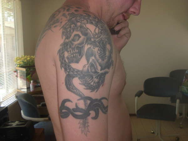 Dragon and skulls tattoo