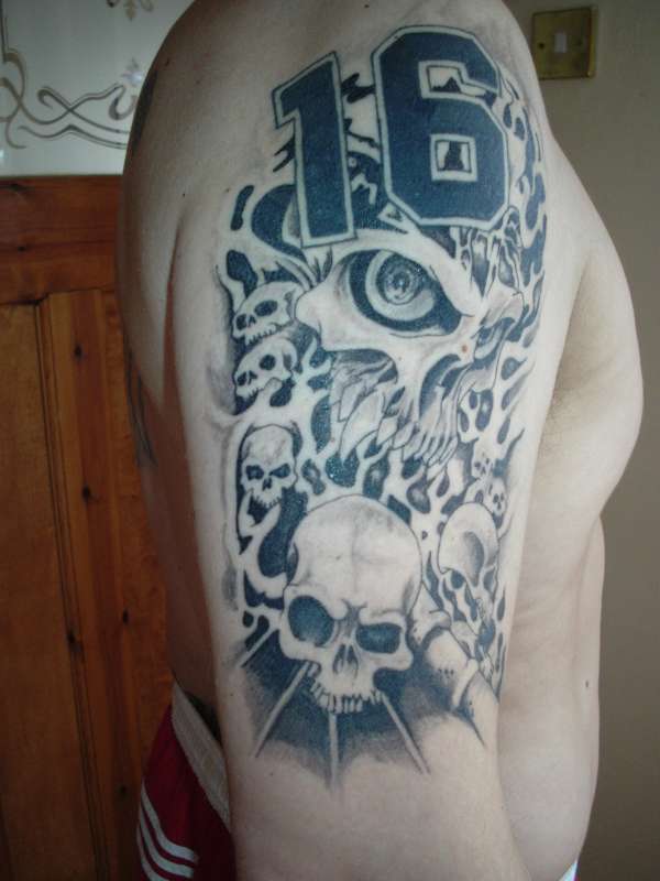 Black and grey skulls tattoo