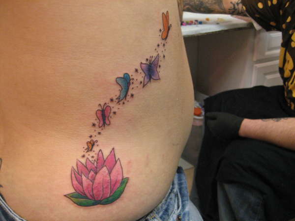 Flower with butterflies tattoo