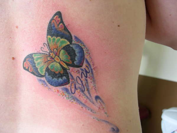 Butterfly flying away tattoo