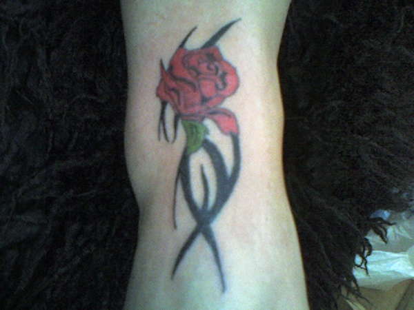 lucys rose and tribal on her foot tattoo