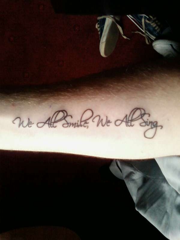 "We All Smile, We All Sing" tattoo