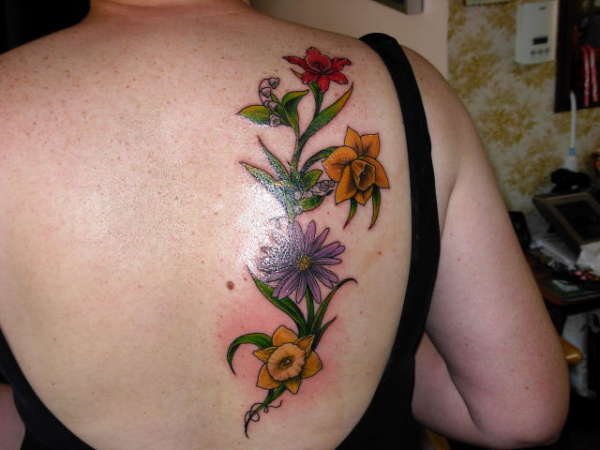 Birth month flowers of my family tattoo