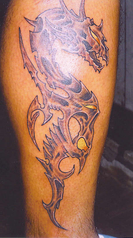 dragon in metal tattoo