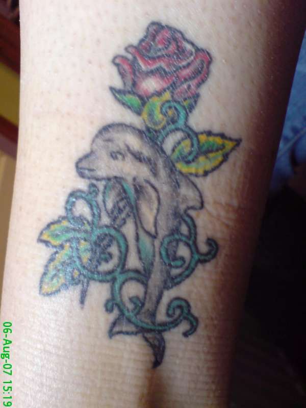 Dolphin with a rose tattoo