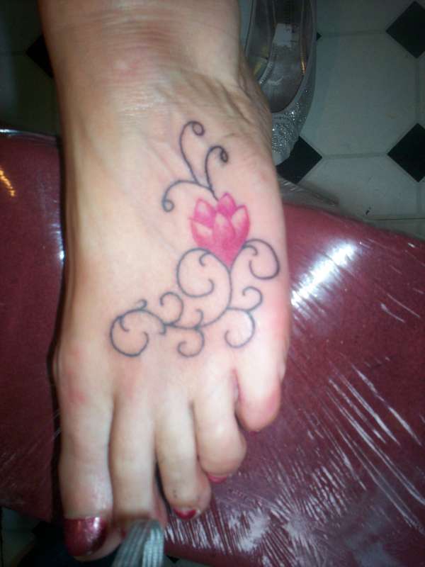 Flower/tribal on foot tattoo