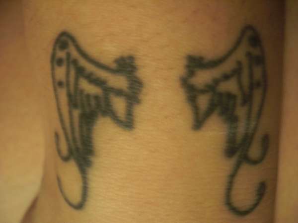 wrist wings tattoo