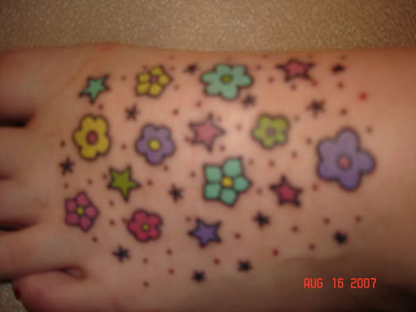 cute and colorful flowers and stars tattoo