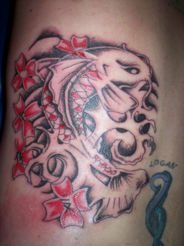 Koi on back of ribs tattoo