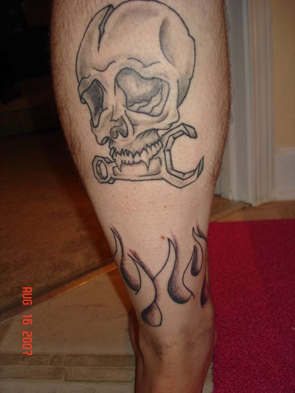 Flames around ankle w/skull tattoo