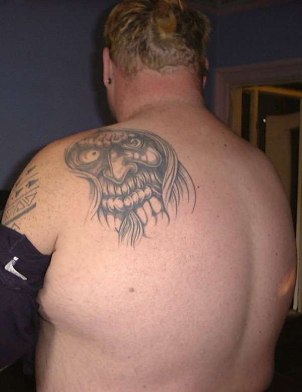 monster on back tattoo