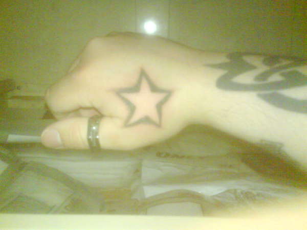 star on hand tattoo