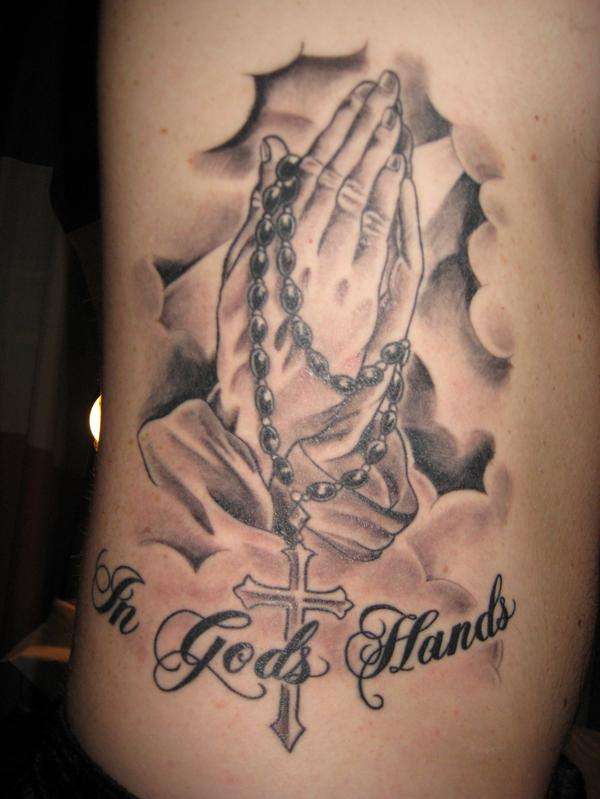 praying hands tattoo