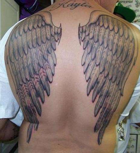 Wings on back tattoo