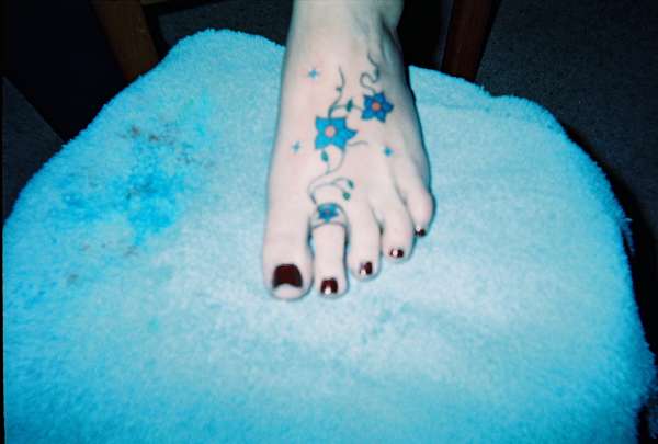 Flower foot tat tattoo