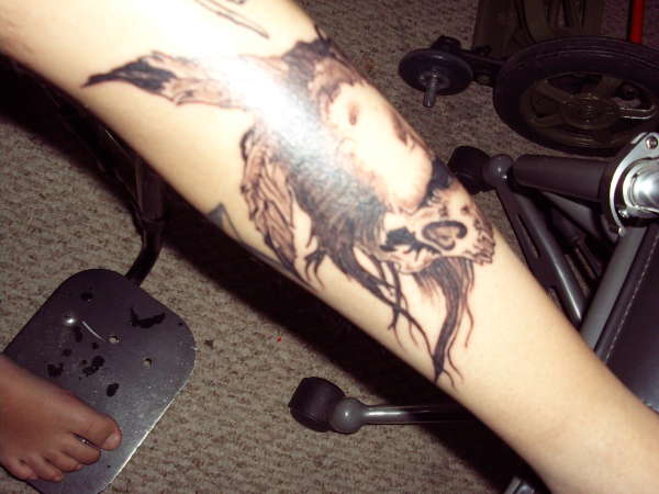 Indian skull w/ feathers & mohawk tattoo