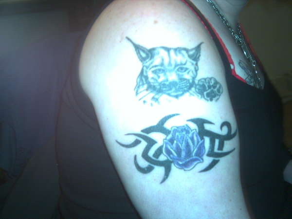 lynx and tribal rose tattoo