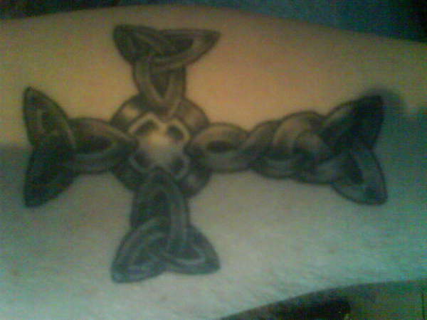 cross on arm tattoo