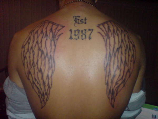 Leons wings tattoo