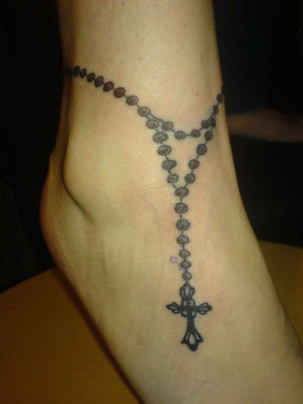 Sarah's rosary tattoo