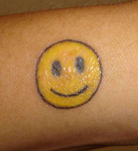Smiley tattoo