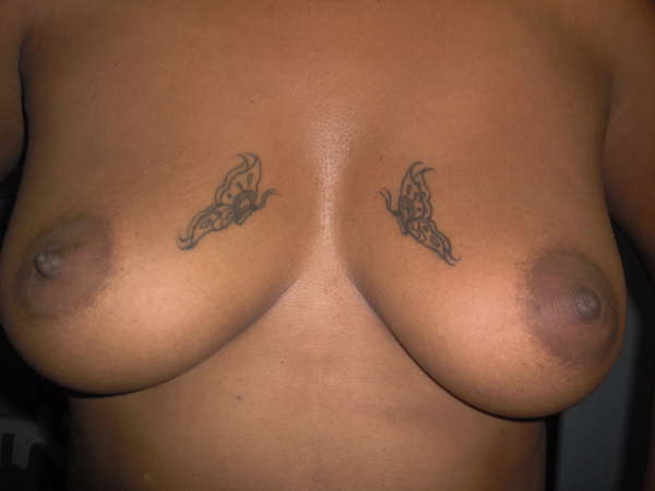 Butterfly boobs tattoo