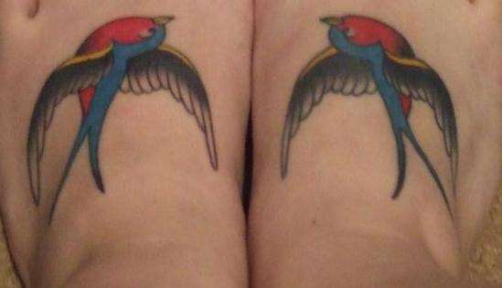Feet swallows tattoo