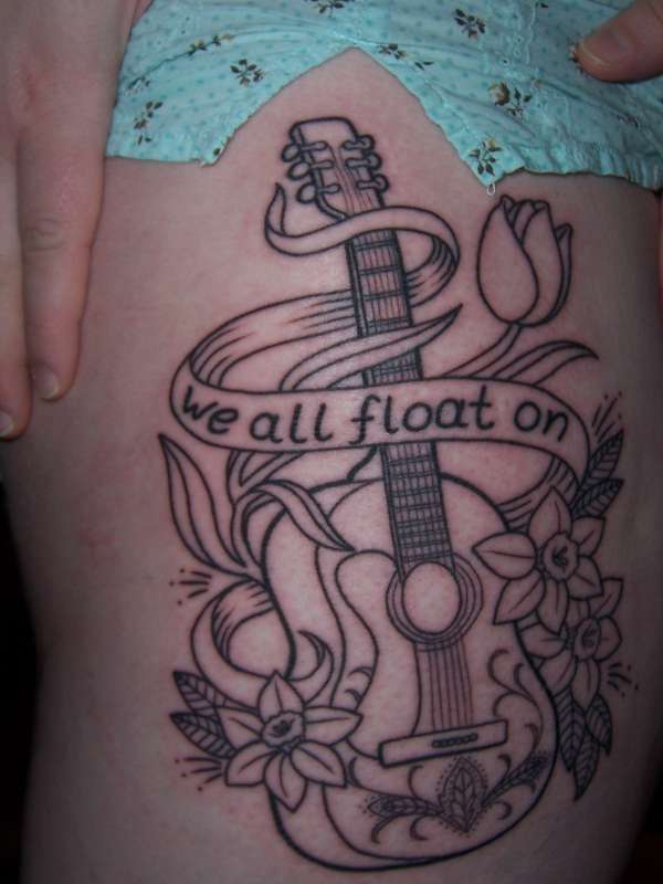 Guitar, daffodils, and tulip tattoo