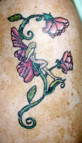 Fairy on vine tattoo