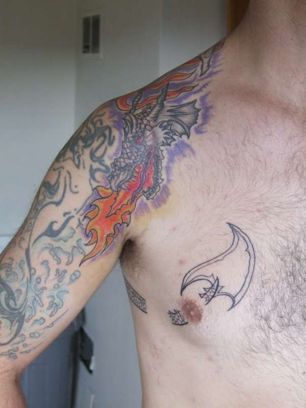 over shoulder dragon tattoo