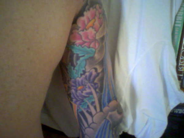 Upper back of right sleeve tattoo