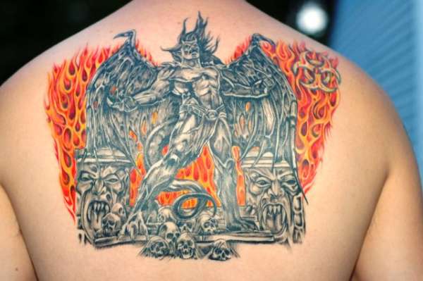 Gargoyle with wall of flames tattoo