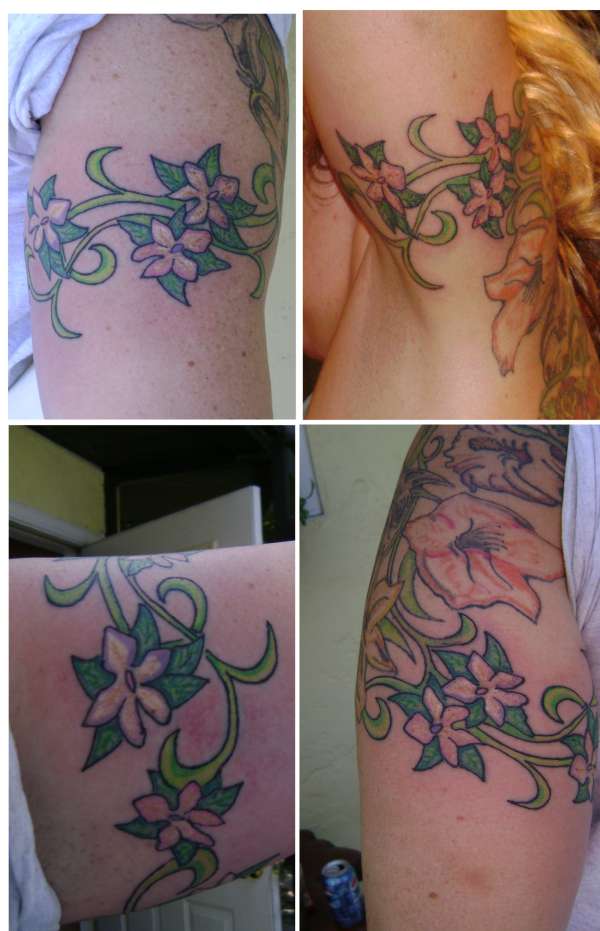 Floral arm band tattoo