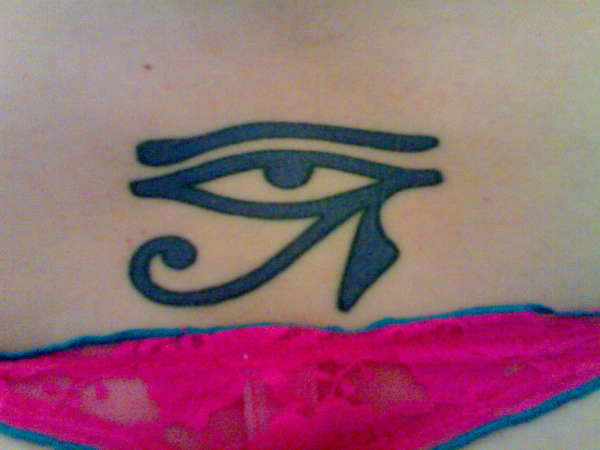 eye of horus on lower back in indigo tattoo