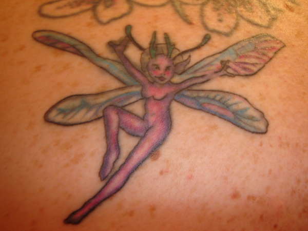 close up of old fairy tattoo