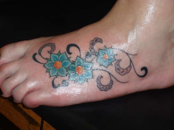cherry blossoms on foot tattoo