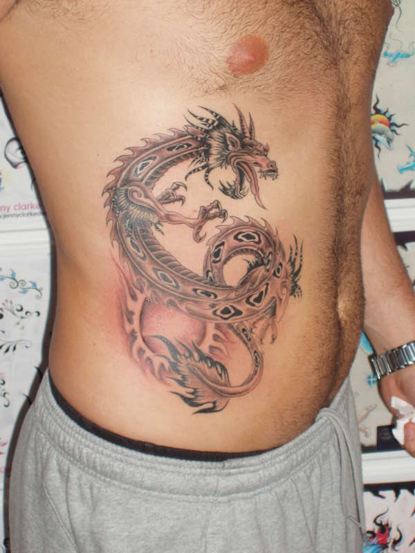 dragon on ribs tattoo