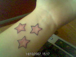3 pink stars tattoo