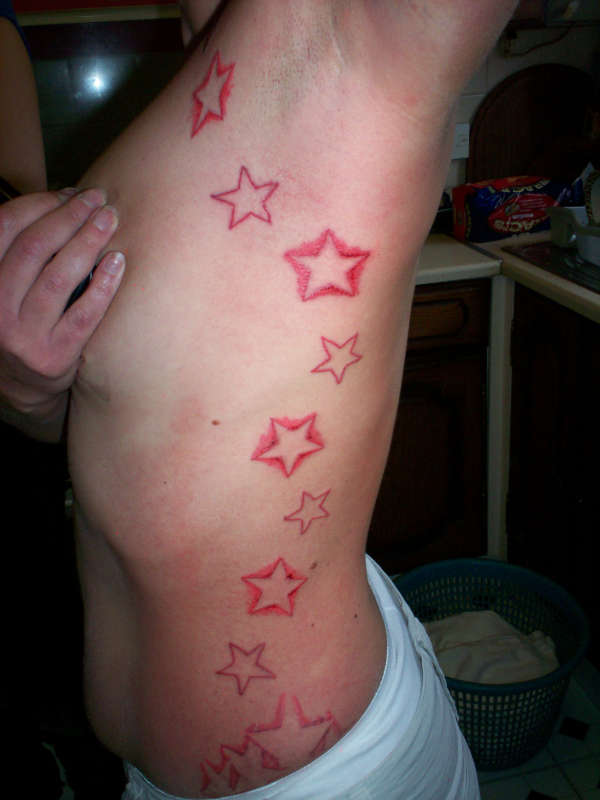 UV & red stars tattoo