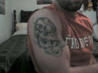 2 skulls with flames tattoo