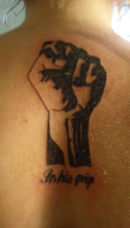 In His Grip tattoo